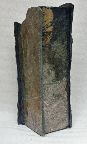 rear view of tall stone vase with tiger's eye