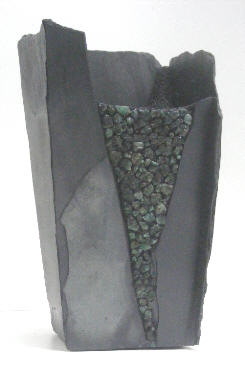 flared stone vase with emeralds